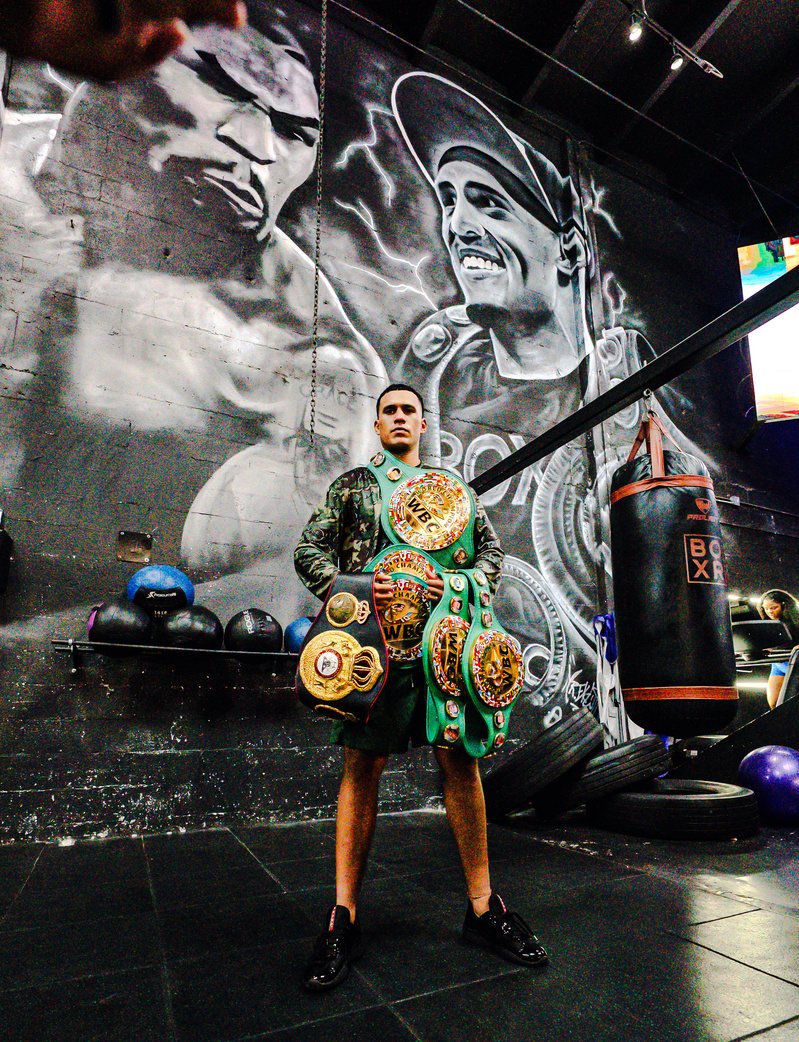 David Benavidez with his world title belts