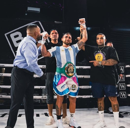 Alberto Palmetta with his hand raised after a win
