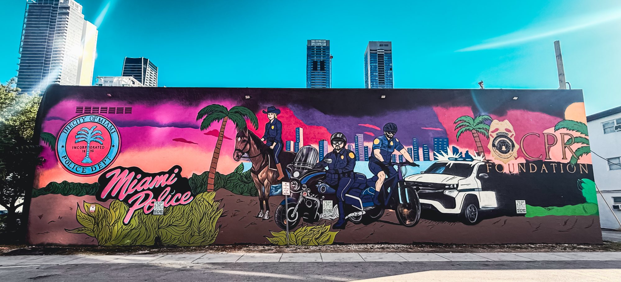 The Miami Police mural on the BOXR wall, with the CPR Foundation