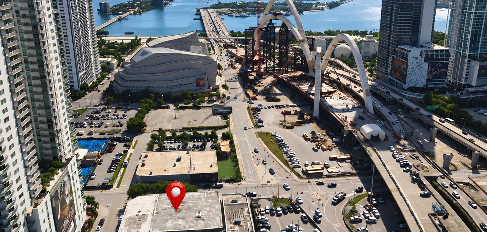 Aerial view of the BOXR rooftop beside the arena and the bay in Downtown Miami